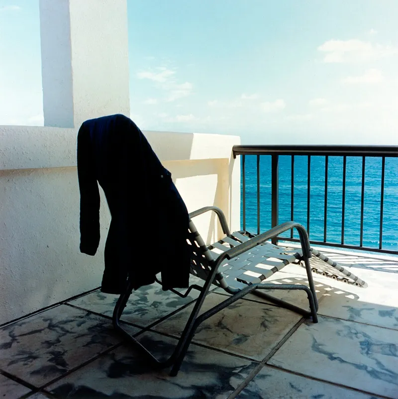Ocean, Chairs, and Shirt — a photograph by Willard Traub.